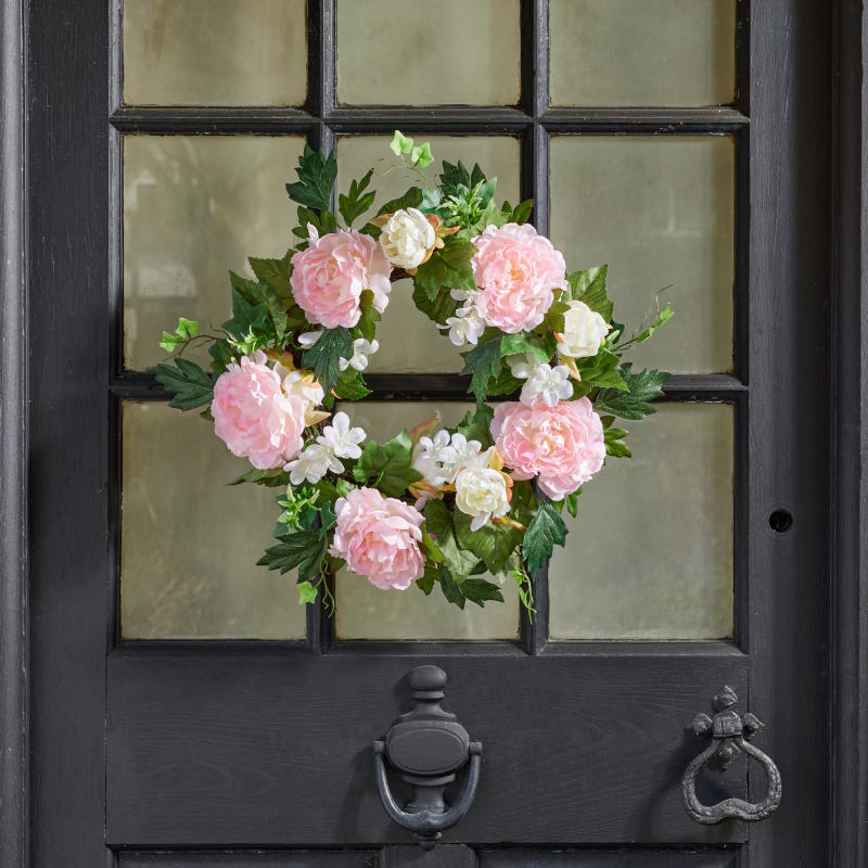 Artificial Peony Wreath hanging on a door