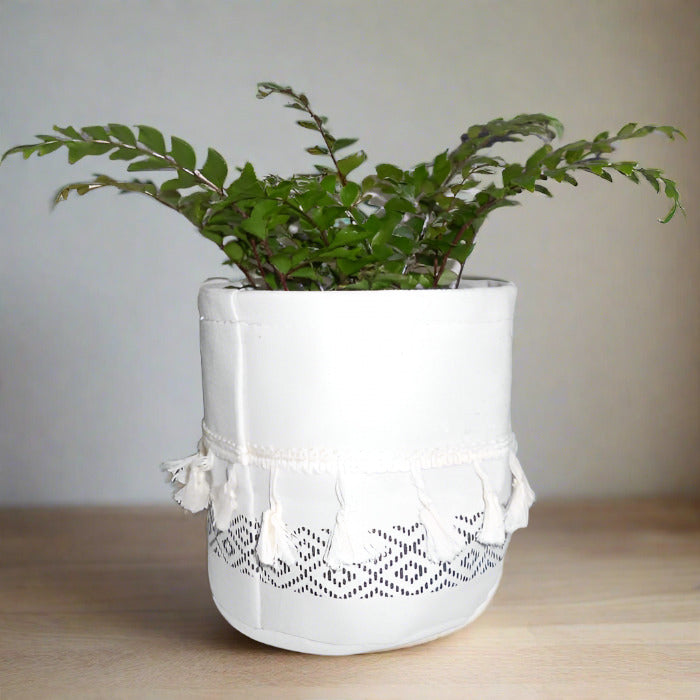 Black and White Tasselled Cotton Plant Pot Cover with houseplant