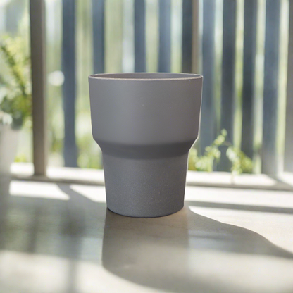 Grey Minimalist Orchid Plant Pot on a windowsill