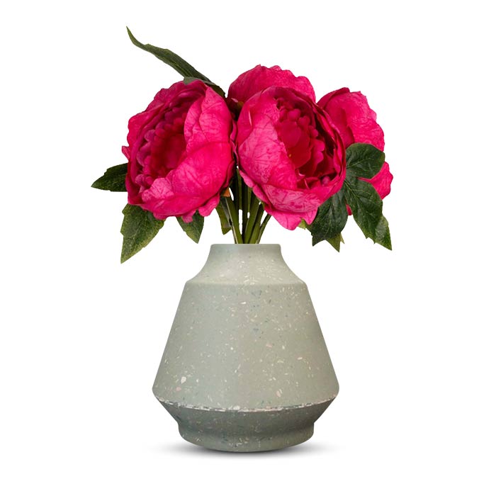 Faux fuchsia pink peonies in a green bell vase